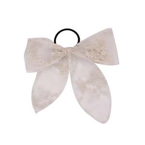Elegant white embroidered lace bow hair clip with black chiffon flower details and long ribbon