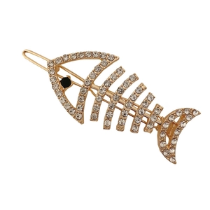 Sparkling rhinestone fishbone hair clip with gold alloy base and black gem eye detail