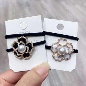 Floral hair ties with micro-pearl edging and center pearl on thick elastic bands