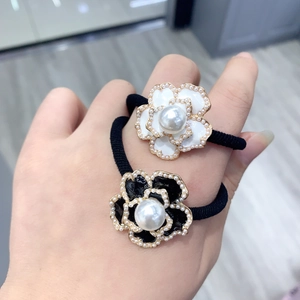 Elegant floral hair ties with faux pearls and rhinestones in classic black and white