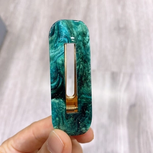 Elegant emerald green marble acetate rectangular hair clip with gold glitter finish