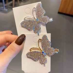 Bow-shaped butterfly hair clips with sparkling rhinestones and colorful gemstones