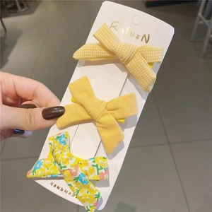 Set di tre fermagli per capelli fatti a mano con fiocchi gialli a quadri e fiori