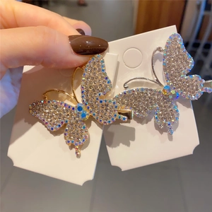 Detail of butterfly hair clips with shimmering rhinestones and colorful crystals