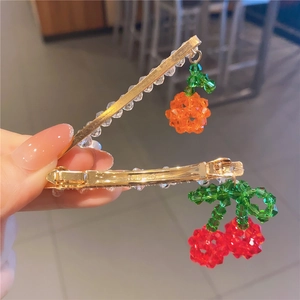 Handmade fruit hair clips with crystal orange and cherry beads on golden metal base