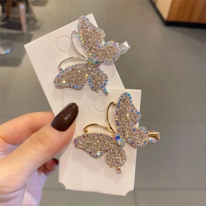 Elegant gold butterfly hair clips with sparkling rhinestones for girls and women
