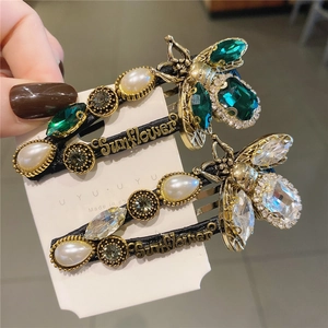 Baroque style bee hair clip set with emerald crystals and Sunflower pearl lettering