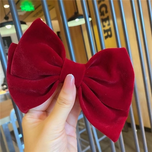 Elegant large burgundy velvet bow hair clip for women with handcrafted texture