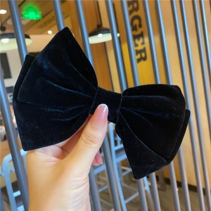 Elegant large black velvet bow hair clip for women with classic double-layered design