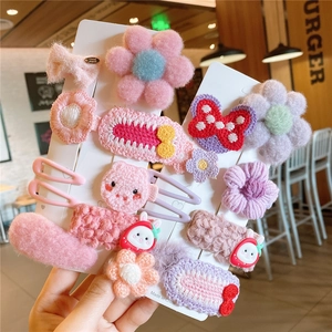 Cute handmade floral hair clips set for girls featuring pink bears and crochet designs