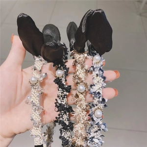 Tweed rabbit ear headbands with pearls in black, blue, and brown woven textures