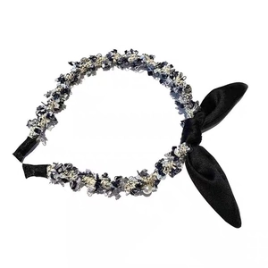 Elegant tweed headband with black satin bow and pearl detail for women and girls