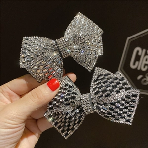 Elegant rhinestone bow hair clips with silver and black crystals for women's hair styling