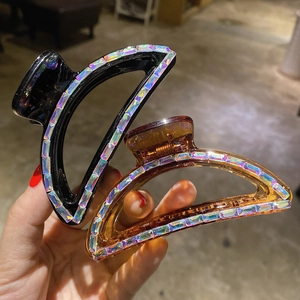 Elegant large hair claw clips with iridescent rhinestones in black and amber colors