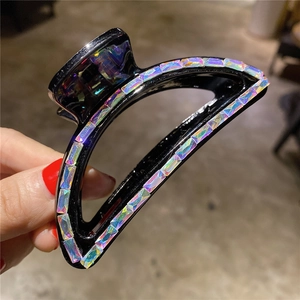 Elegant large black hair claw clip with rainbow rhinestones for bun hairstyles