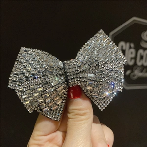 Sparkling rhinestone bow hair clip for women with premium silver-toned finish and crystals