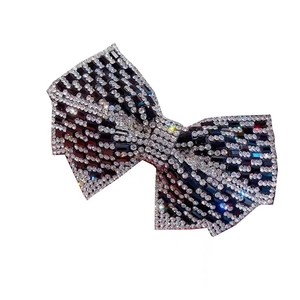 Sparkling rhinestone bow hair claw clip with black and white striped crystal design