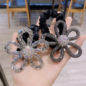 Velvet hair scrunchies with crystal flower accents and sparkling rhinestones for women