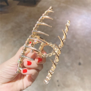 Pince à cheveux dorée étincelante avec strass colorés pour chignon de style français