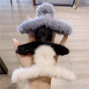 Elegant faux fur hair claw clips in grey black and white plush material for women