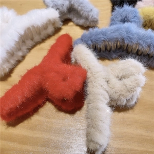 Plush faux fur hair claws in various colors for elegant autumn winter hairstyles