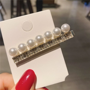 Elegant fan-style hair clip featuring white pearls and sparkling rhinestones on silver alloy