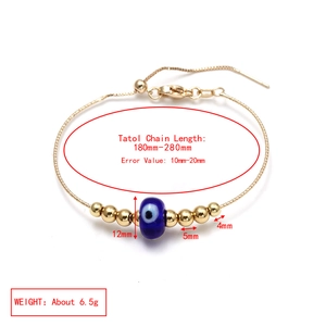 Adjustable golden box chain bracelet with blue evil eye bead and polished gold beads