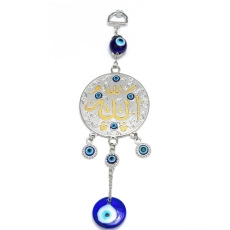 Detailed shot of evil eye butterfly keychain with blue glass and golden Arabic calligraphy