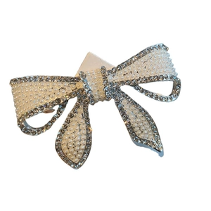 Barrette à cheveux élégante en forme de nœud avec strass brillants et perles blanches chic