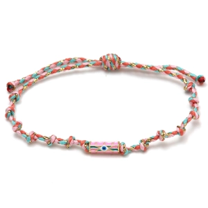 Detail of hand-woven pink and mint cord bracelet with enamel evil eye charm