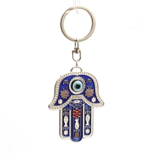 Macro shot of silver Hamsa Hand keychain with blue evil eye enamel and lobster clasp