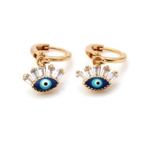 Close-up of golden evil eye huggie earrings with blue enamel and sparkling zircon stones