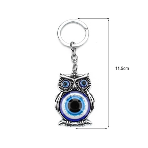 Detail view of owl evil eye keychain pendant in vintage silver with 11.5cm total length