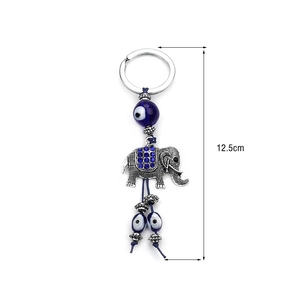 Detailed view of lucky elephant evil eye keychain with measurements and dimensions