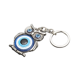 Silver owl evil eye keychain with blue glass nazar protection charms and metal feathers