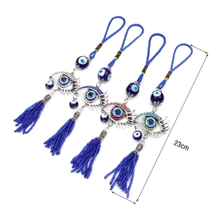 Detail showing 23cm Turkish Evil Eye ornaments with colorful rhinestones and blue tassels