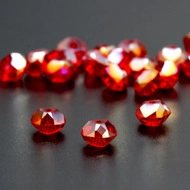 Macro shot of faceted pomegranate red crystal beads for DIY jewelry making and design