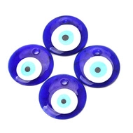 Close-up of four dark blue glass evil eye charms with pre-drilled holes for DIY jewelry