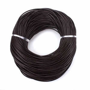 Macro view of 2mm dark brown round leather cord roll for DIY jewelry weaving crafts