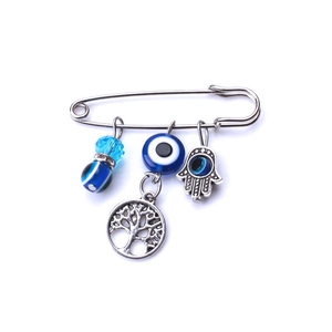 Spilla vintage in argento con ciondoli occhio del diavolo blu e mano di Fatima