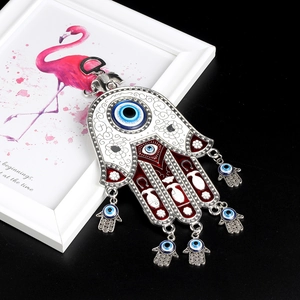 Turkish Evil Eye Hamsa Hand wall hanging with silver metal elephant and red blue accents