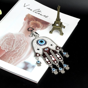 Detailed Hamsa Hand with Evil Eye lucky charm wall hanging in polished silver and blue