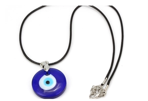Detailed close-up of blue glass evil eye pendant with black braided wax cord and metal clasp