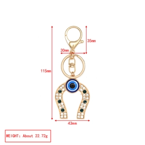 Detailed view of evil eye horseshoe keychain with dimensions 115x43mm and weight 22.72g
