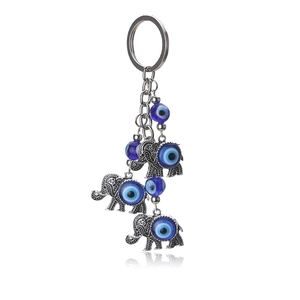 Porte-clés éléphant chanceux avec perles bleues Mauvais Œil et pendentifs en argent