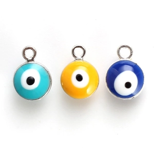 Three colorful Evil Eye pendants in light blue, yellow, and navy for DIY jewelry