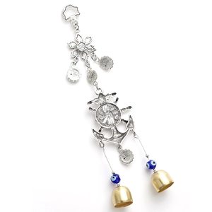 Marine anchor and helm wind chime with evil eye beads and golden bells on white background