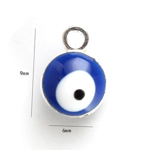 Macro shot of 6mm blue evil eye charm with silver frame for DIY jewelry making