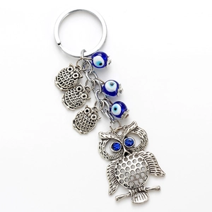 Porte-clés chouette argenté avec perles mauvais œil bleues et pendentifs hibou