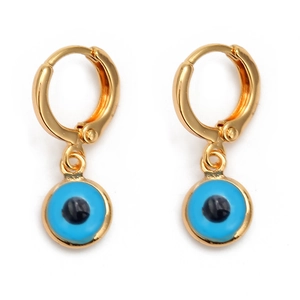 Golden hoop earrings with blue Evil Eye charms in a minimalist and vintage design